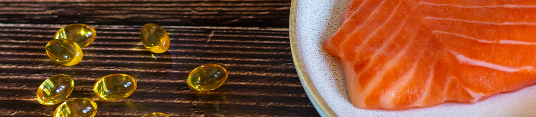 Omega-3 Sources Omega-3 supplements and salmon.