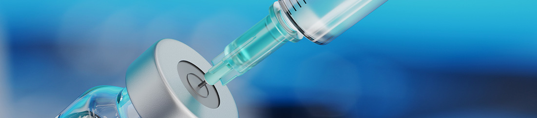 Vaccine Preparation A Syringe drawing medicine from a vial.