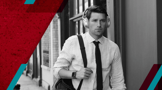 Man in business attire wearing headphones, walking with a bag, framed by red geometric shapes.