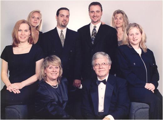 Family portrait taken circa June 1997. Seated (center): Cryer and Carolyn Havlin-Cryer. From left: Mary Gudermuth Cryer (wife of Philip Clifford Cryer), Justine Laurel Cryer Dugan, Philip Clifford Cryer, Anthony Victor Havlin, Krista Victoria Havlin, and Rebecca Elizabeth Havlin Eberhart.