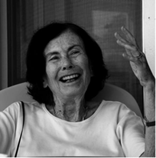 Maria Gordon Buse, MD, circa 2012, engaged in conversation on the porch of her beach house (courtesy of Katherine Buse).
